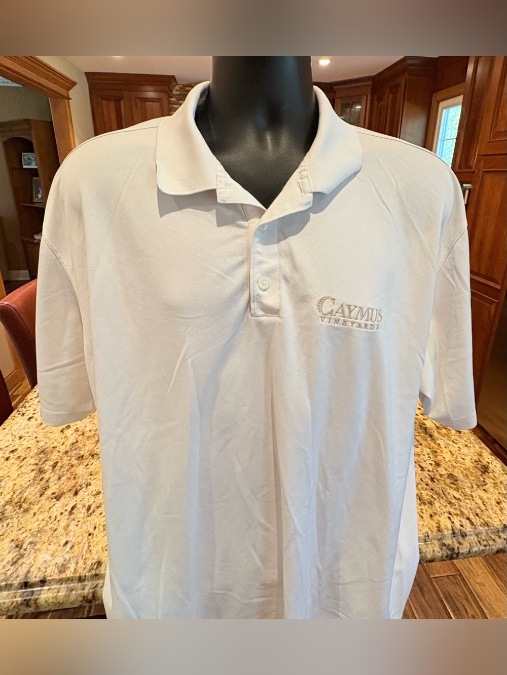 Nike men’s Caymus Vineyards polo. Sharp white with Embroidered logo on chest.